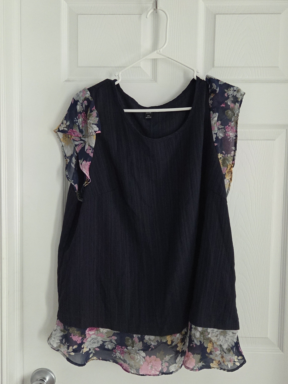 Sleeveless Navy Blouse with Floral Sheer Trim